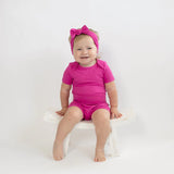 Kyte Baby Short Sleeve Bodysuit in Raspberry