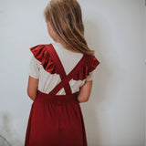 KID'S RUFFLE PINAFORE | CRANBERRY